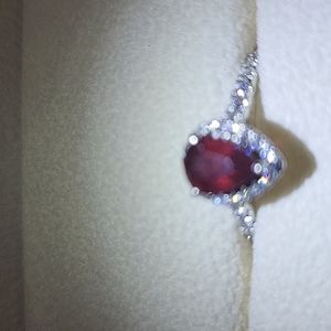 1ct pear shape ruby set in platinum ring.